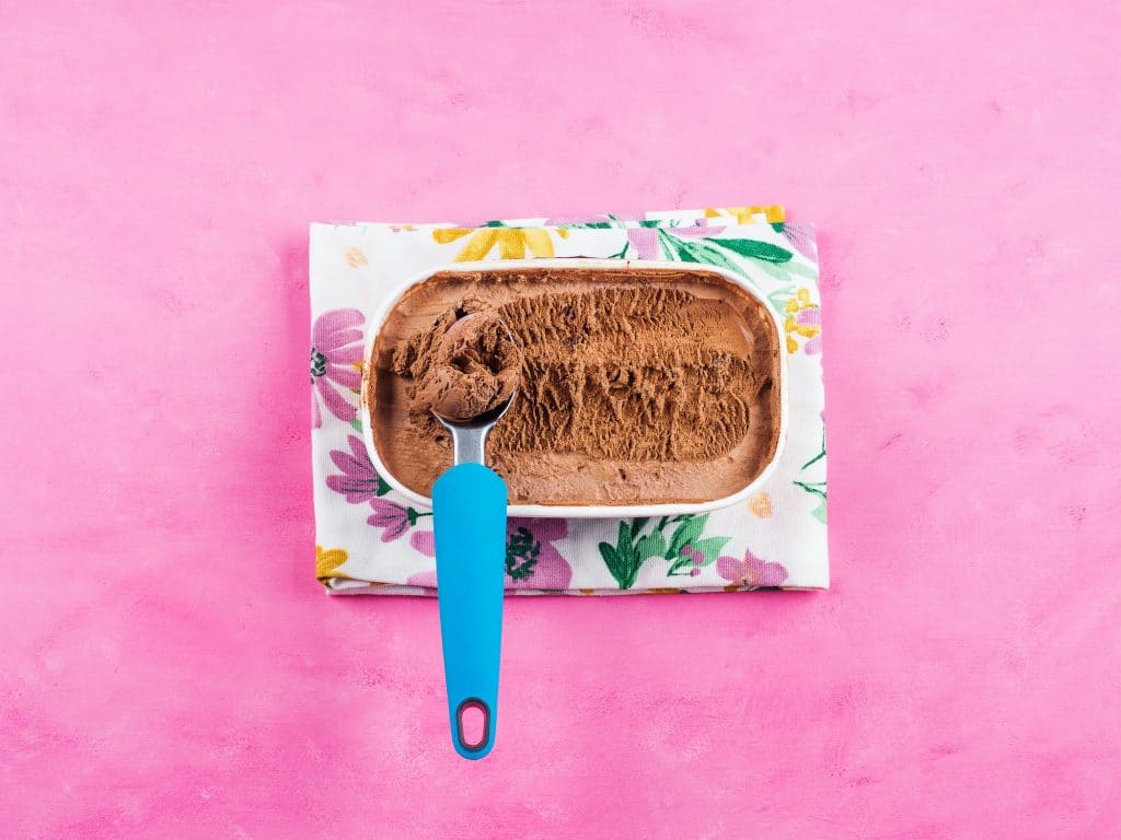 Ice cream scoop in chocolate ice cream tub